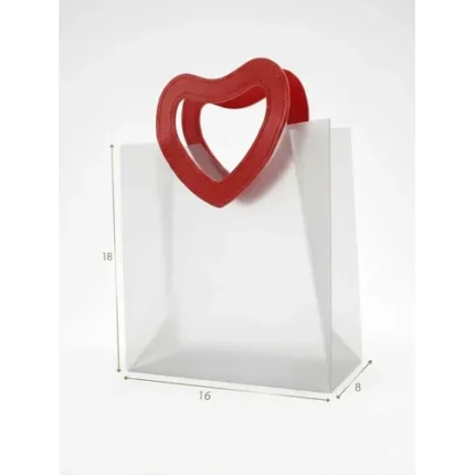 SACOLA TRANSPARENTE PVC FOSCO ALÇA CORAÇÃO VERMELHO 16X18,5+8CM